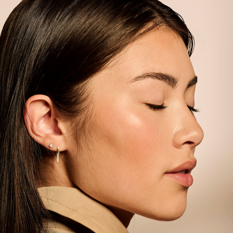 Oorknopjes van bicolor goud met 14k wit en rosé goud, kleine ronde vorm.