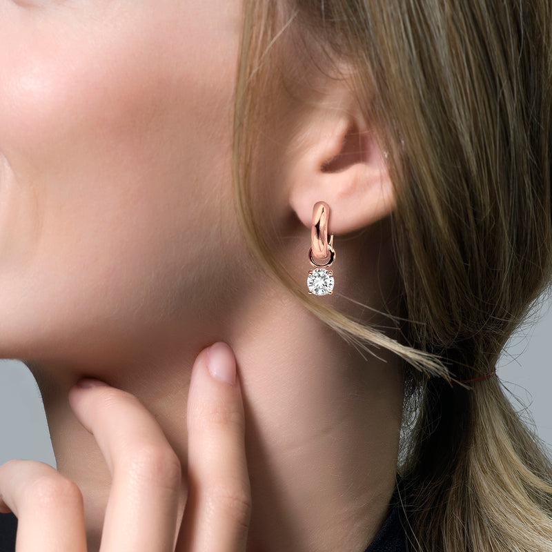 14k Rosé goud oorbel met ronde zirkonia hangend aan rosé gouden creoolring.