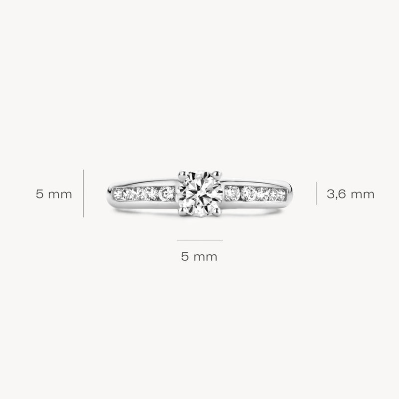 Ring 1154WZI 585er Weißgold mit zentraler zirkonia und Seiten mit kleinen Steinen, 5 mm breit, 3,8 mm hoch.
