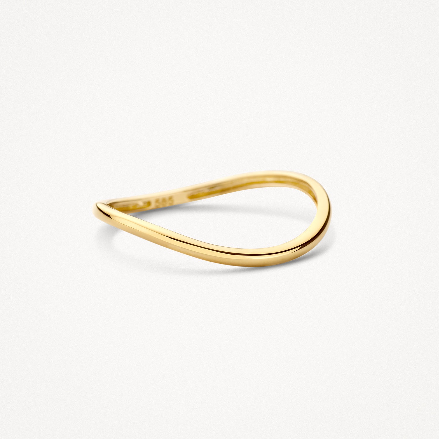 A genuine 14ct yellow gold delicate stackable ring with a polished band, close-up.