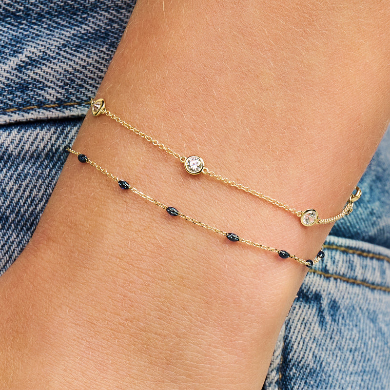 Bracelet avec zircones de 4 mm serti clos en or jaune 14 carats