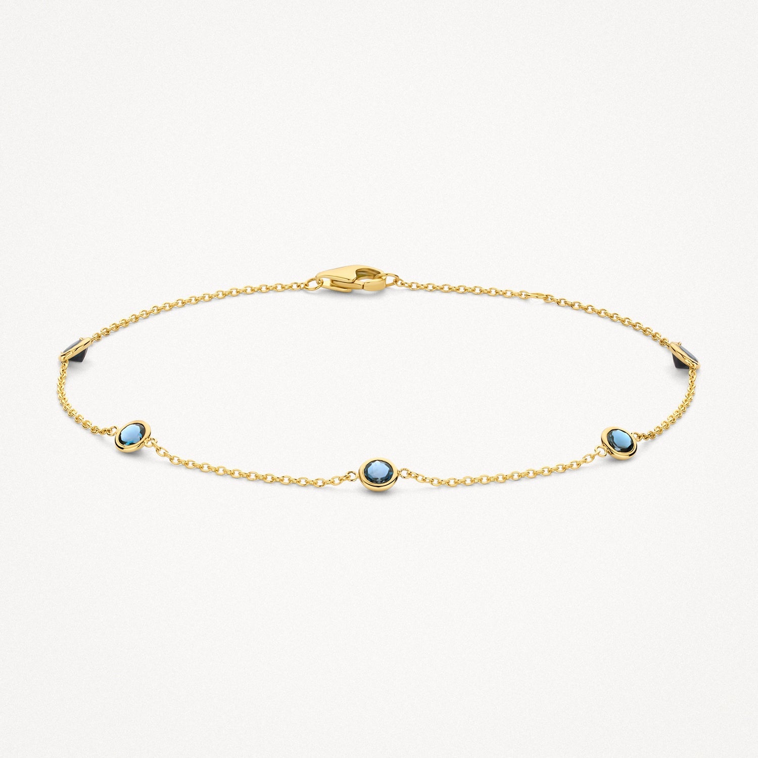 14ct Yellow gold link bracelet with London blue topaz, front view.