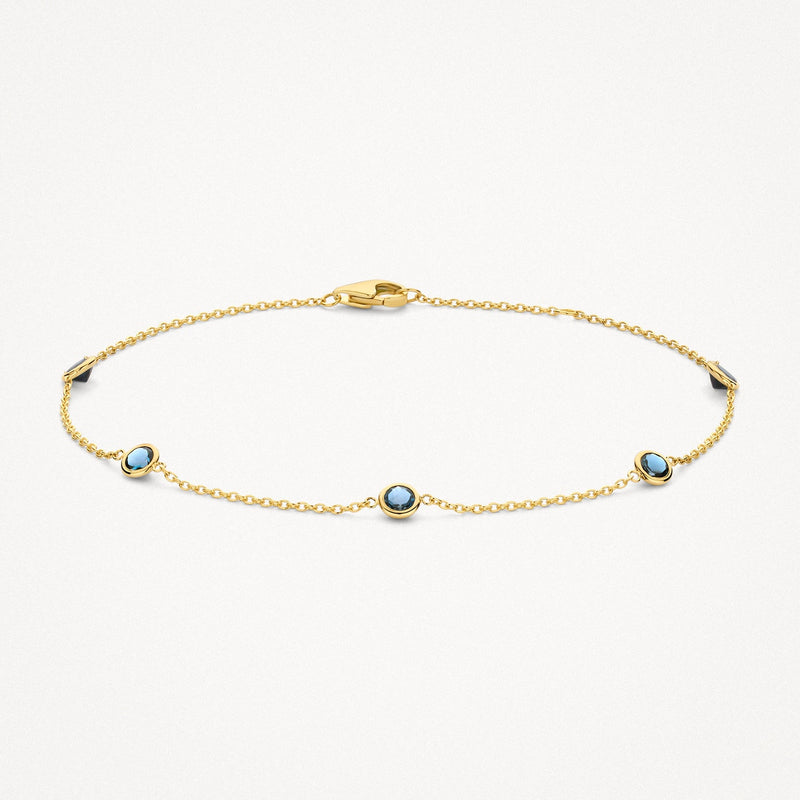 14ct Yellow gold link bracelet with London blue topaz, front view.