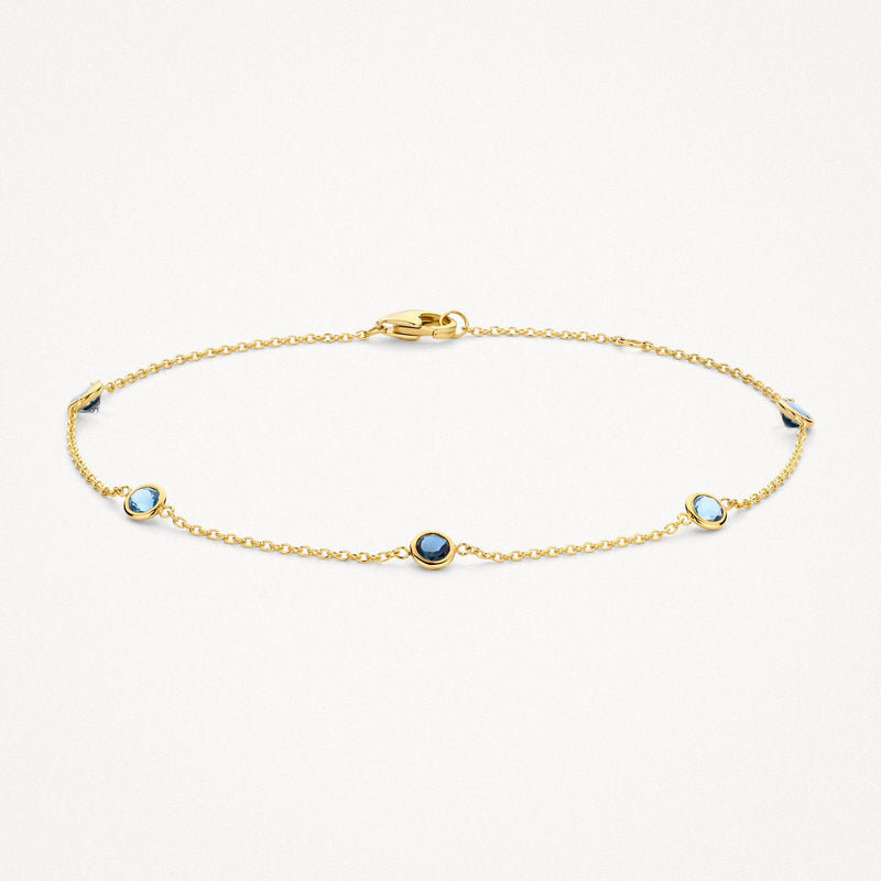 Bracelet à maillons en or jaune 14 carats avec topaze bleu ciel, vue de face.