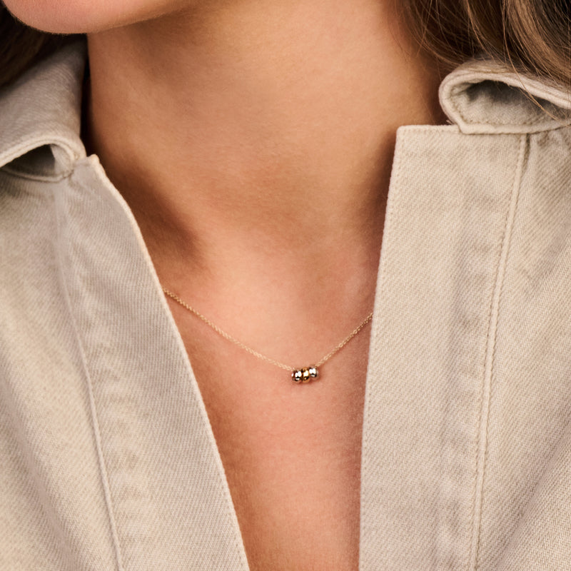 Ketting met 3 ringetjes in 14k bicolor goud