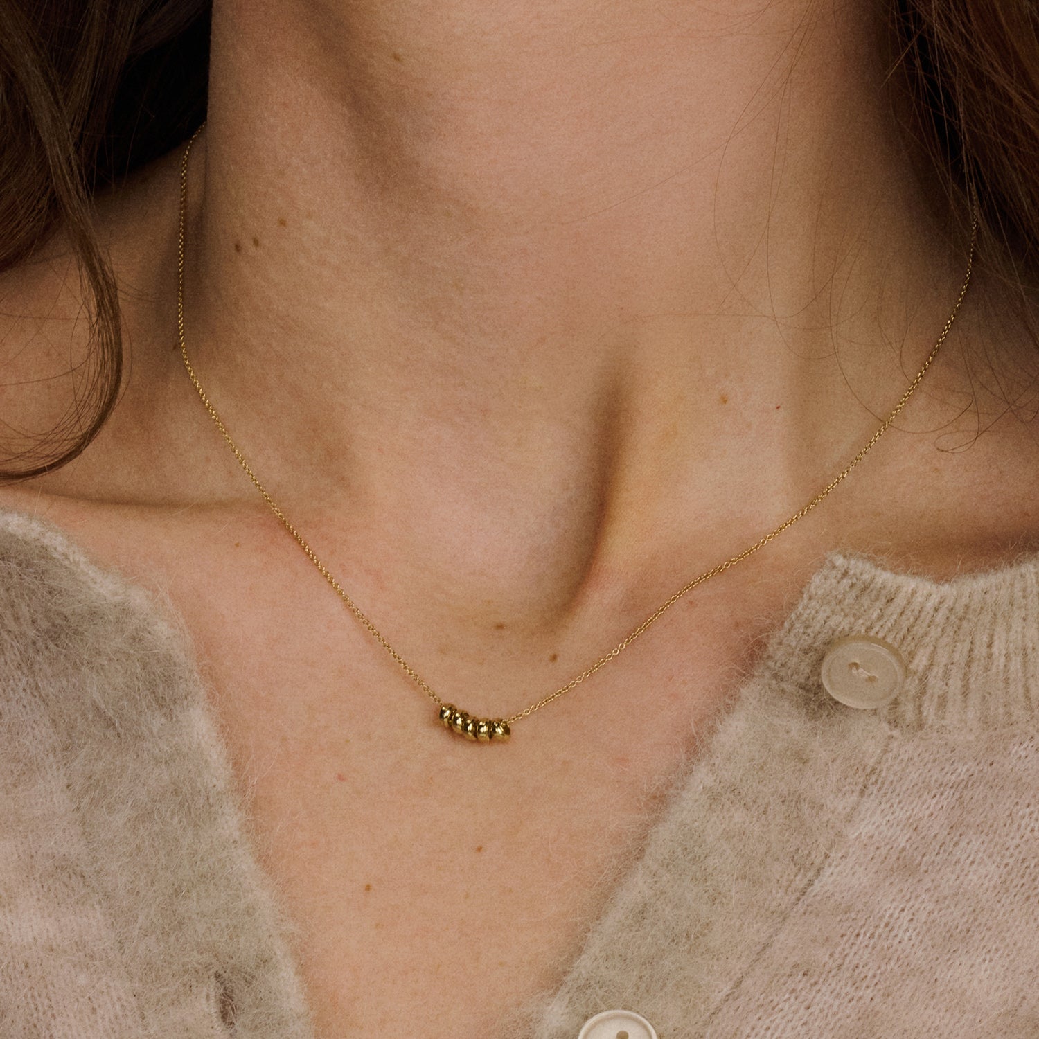 Ketting met vijf ringvormige hangers 14k goud