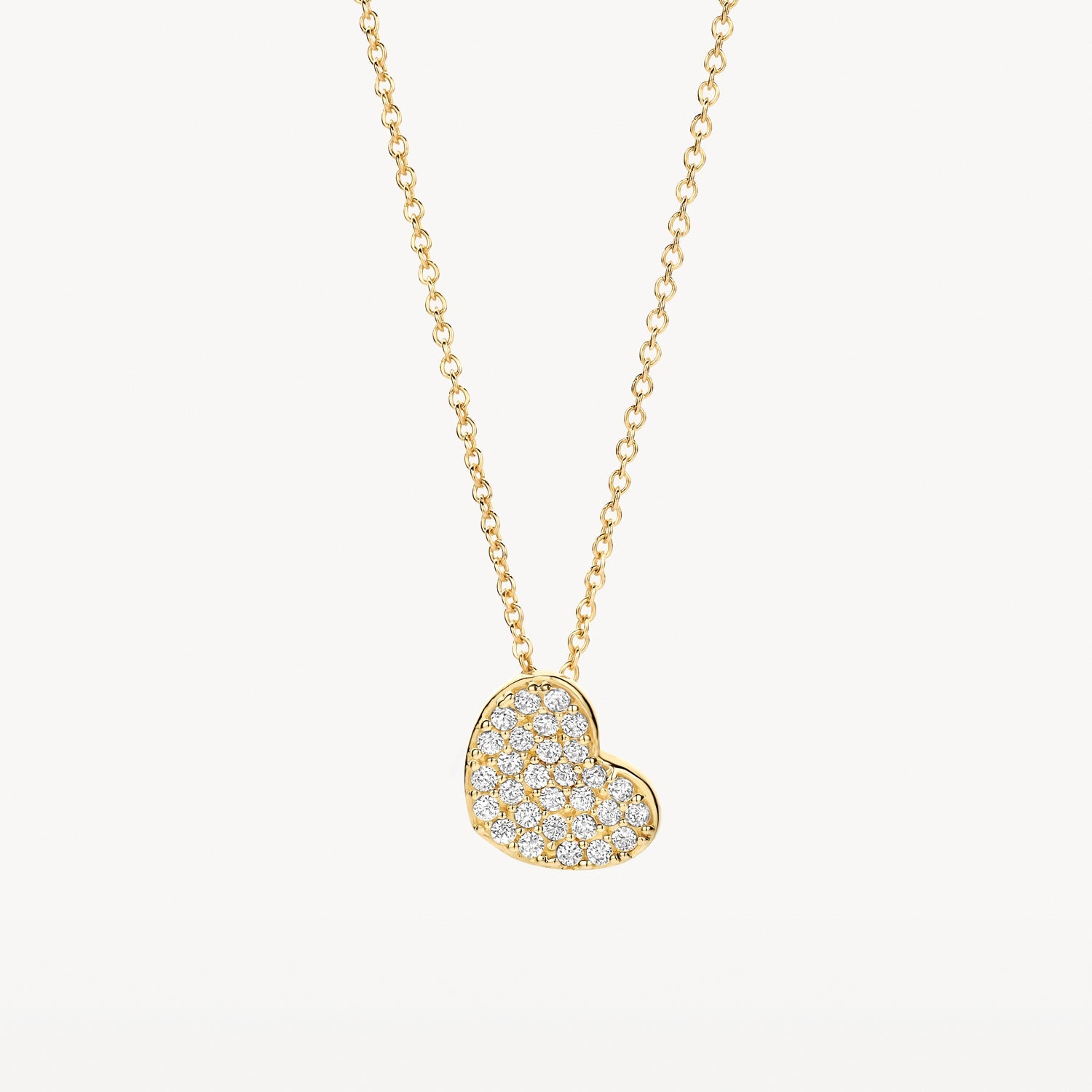 Collier en or jaune 14 carats avec pendentif en forme de cœur Zircone, gros plan.