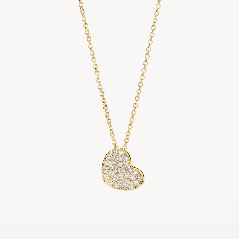 Collier en or jaune 14 carats avec pendentif en forme de cœur Zircone, gros plan.