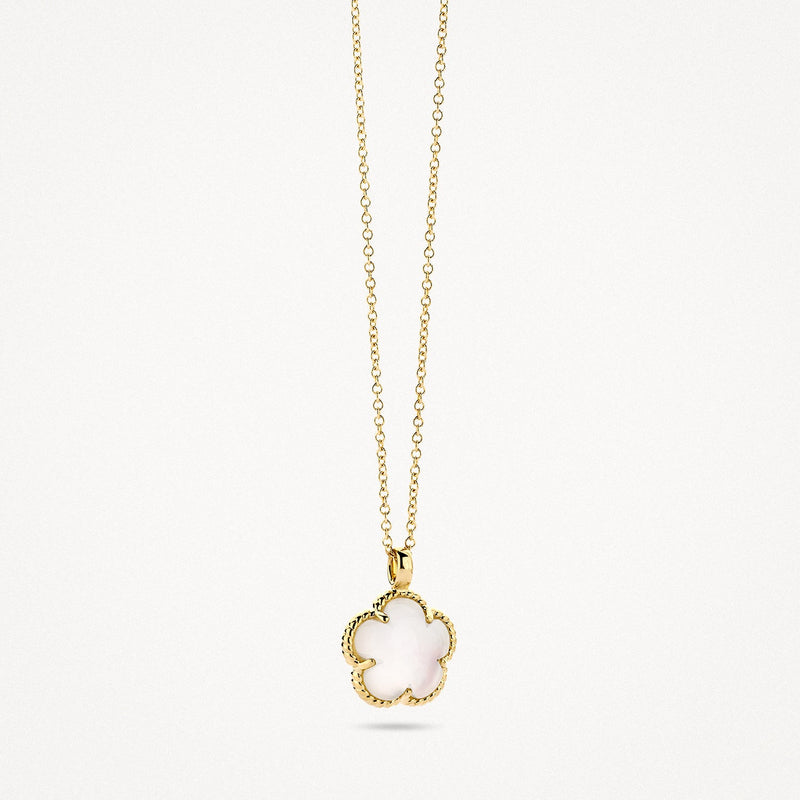 Collier en or jaune 14 carats avec pendentif blanc Nacre, vue de profil.