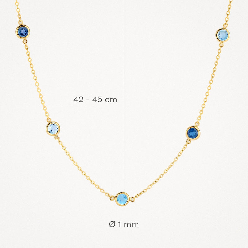 Collier en or jaune 14 carats avec une topaze bleu ciel, d'une longueur de 42 à 45 cm.