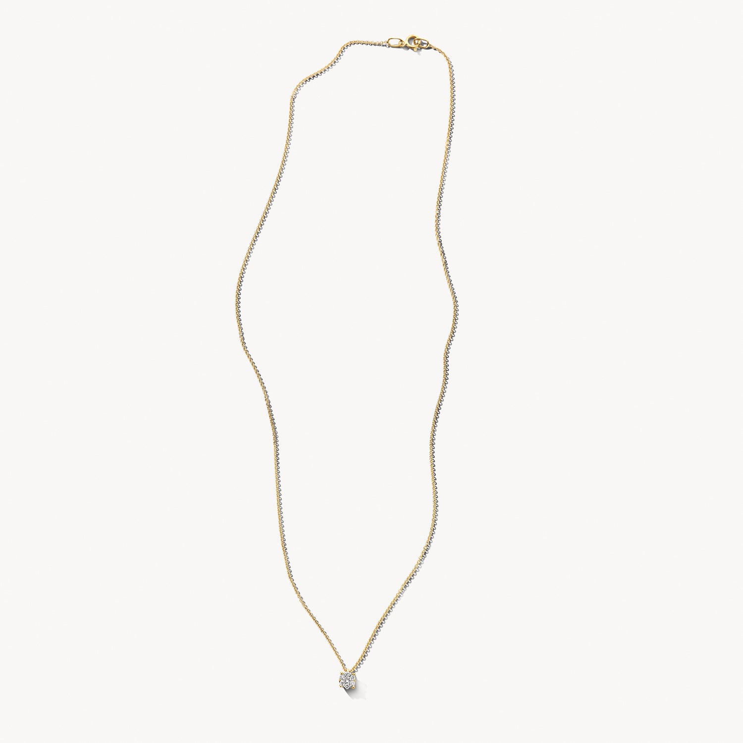 Collier van 14k goud met kleine ronde diamant aan fijne ketting.