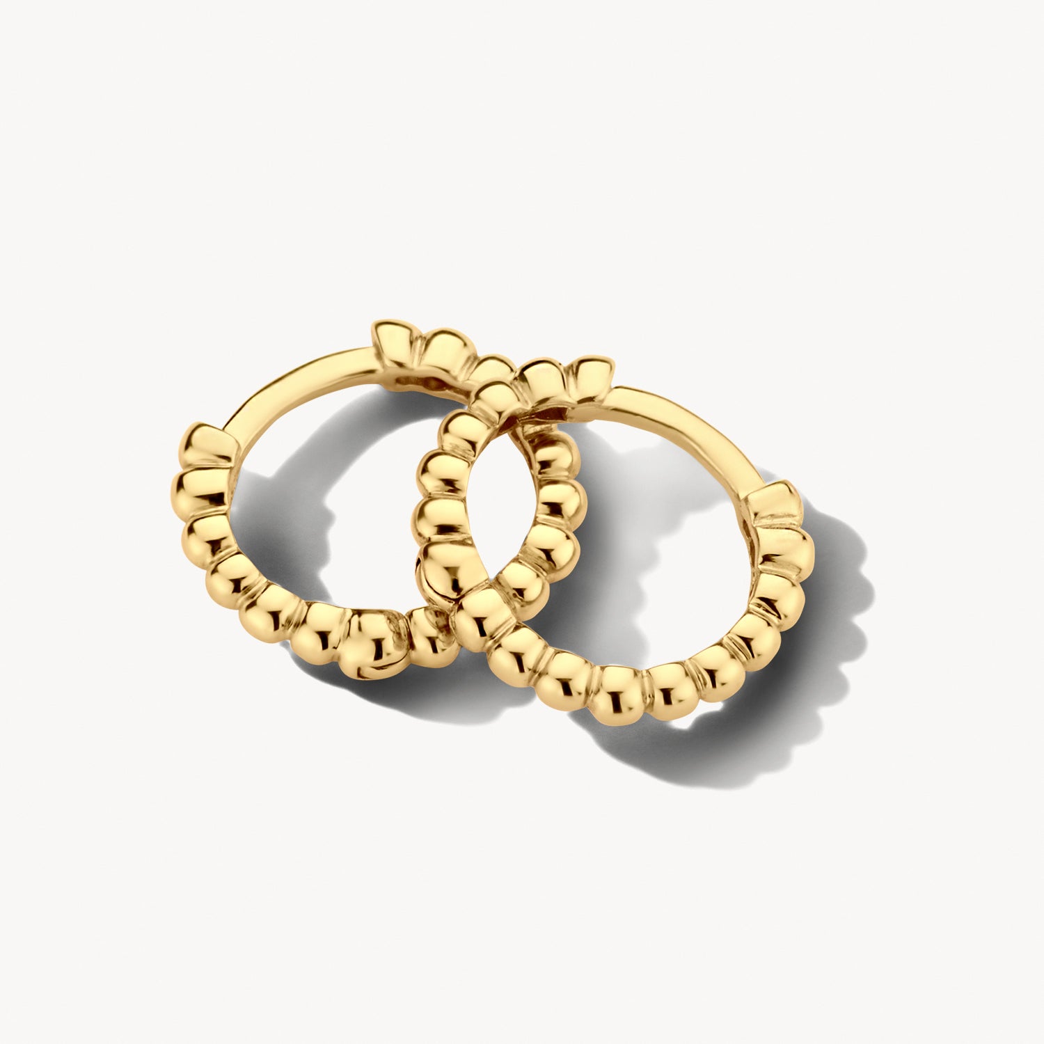 Oorringen met bolletjesmotief 9 mm 14k goud