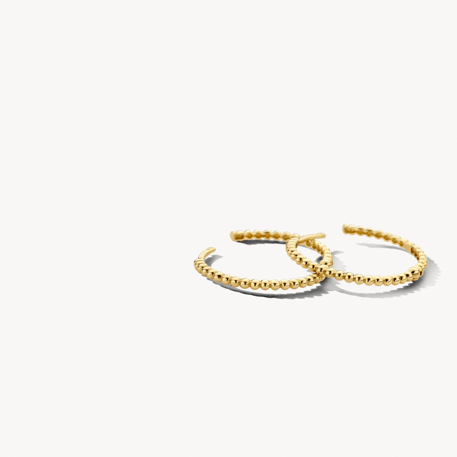 Oorringen met bolletjesmotief 20 mm 14k goud