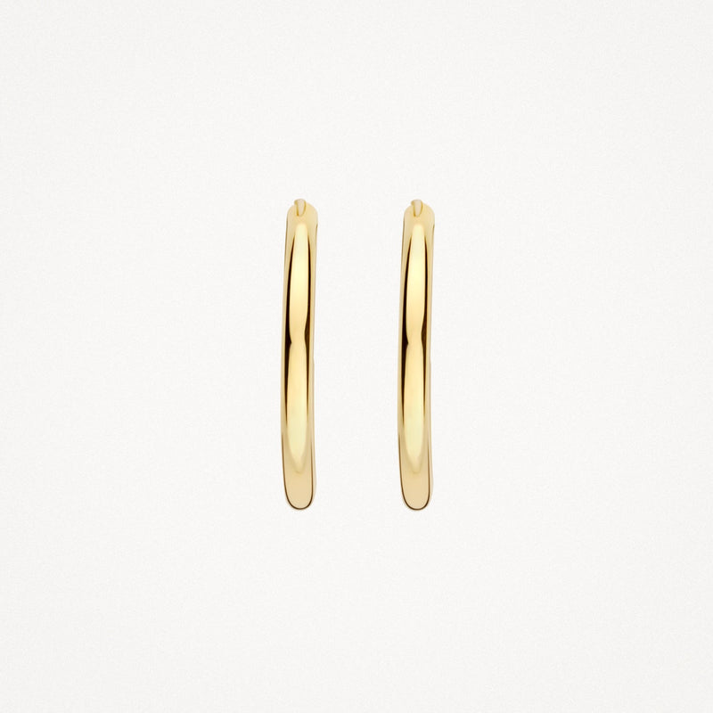 Véritable bague ronde en or jaune 14 carats Créoles avec finition polie, gros plan.