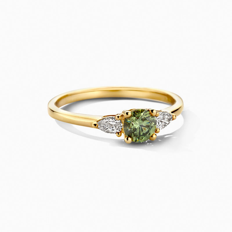 14ct yellow gold ring with clear and green Lab Grown Diamond, close-up.