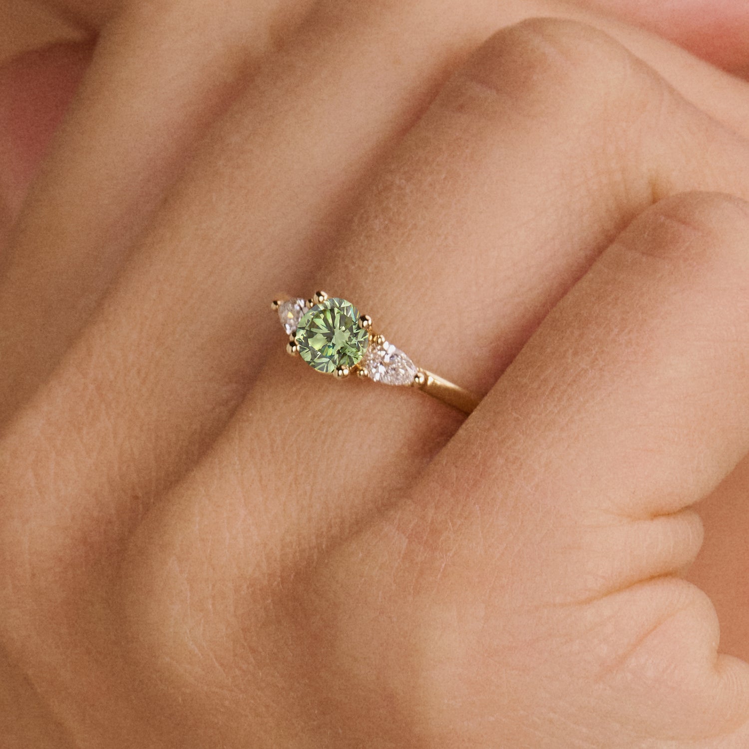 14ct yellow gold ring with Lab Grown Diamond and green Diamond, front view.