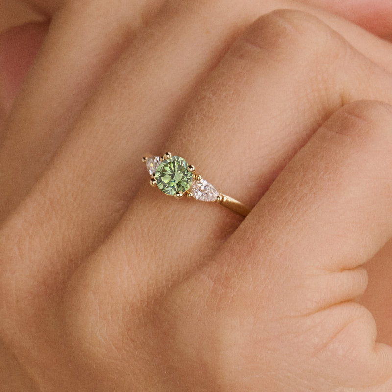 14ct yellow gold ring with Lab Grown Diamond and green Diamond, front view.
