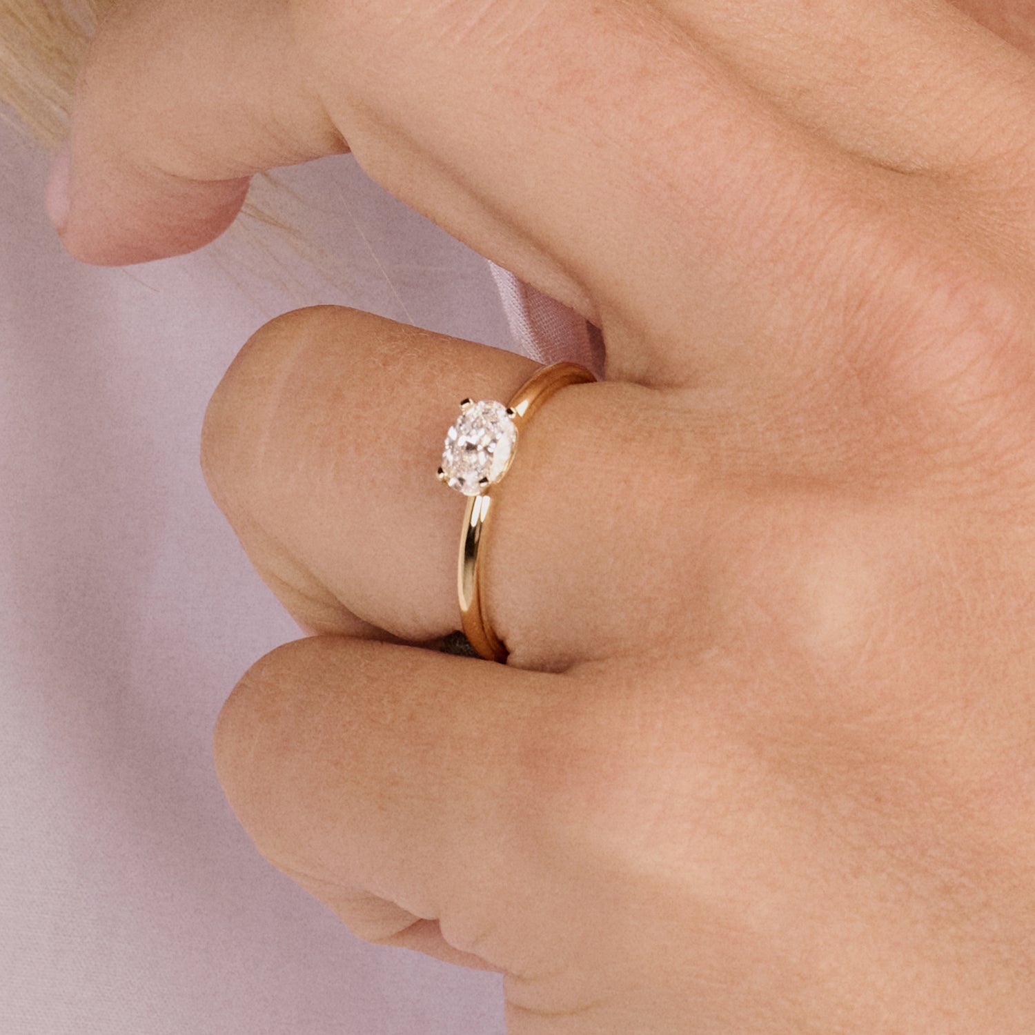 14ct yellow gold ring with an oval Lab Grown Diamond, front view.