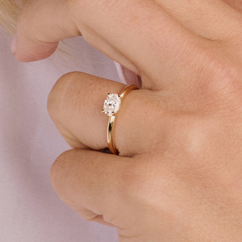 14ct yellow gold ring with an oval Lab Grown Diamond, front view.