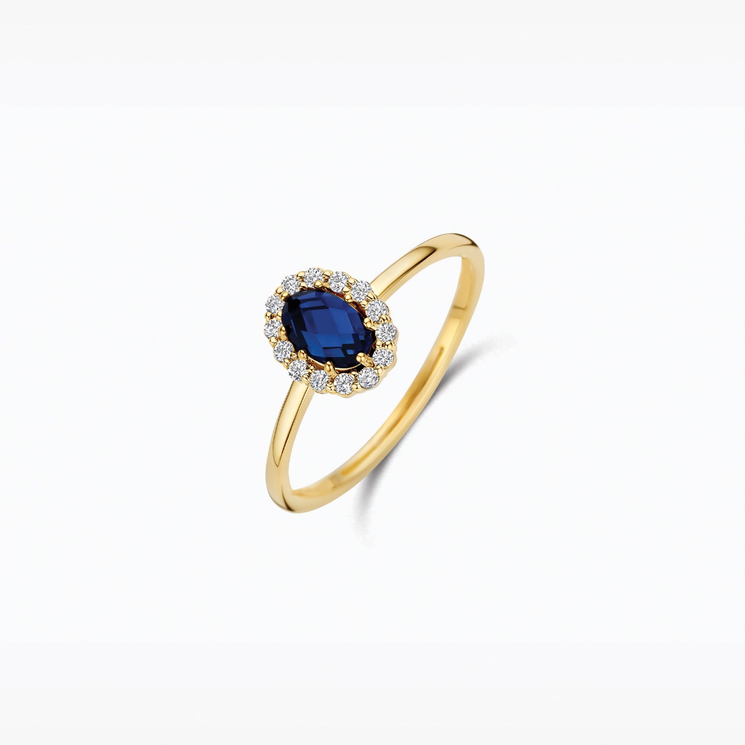 En or 14 carats Jaune et en or blanc Bague, avec Diamant de synthèse et une pierre bleue, vue de profil.