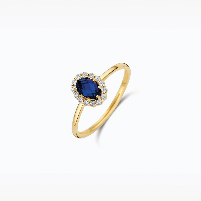En or 14 carats Jaune et en or blanc Bague, avec Diamant de synthèse et une pierre bleue, vue de profil.