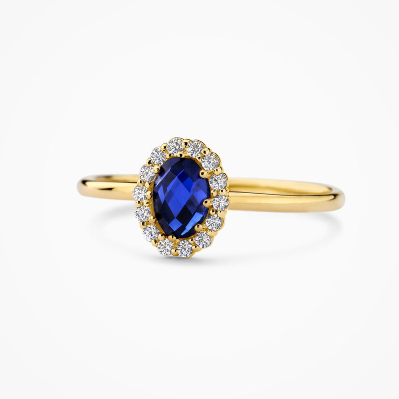 Or 14 carats Jaune et or blanc Bague, avec un diamant synthétique et un diamant bleu, gros plan.