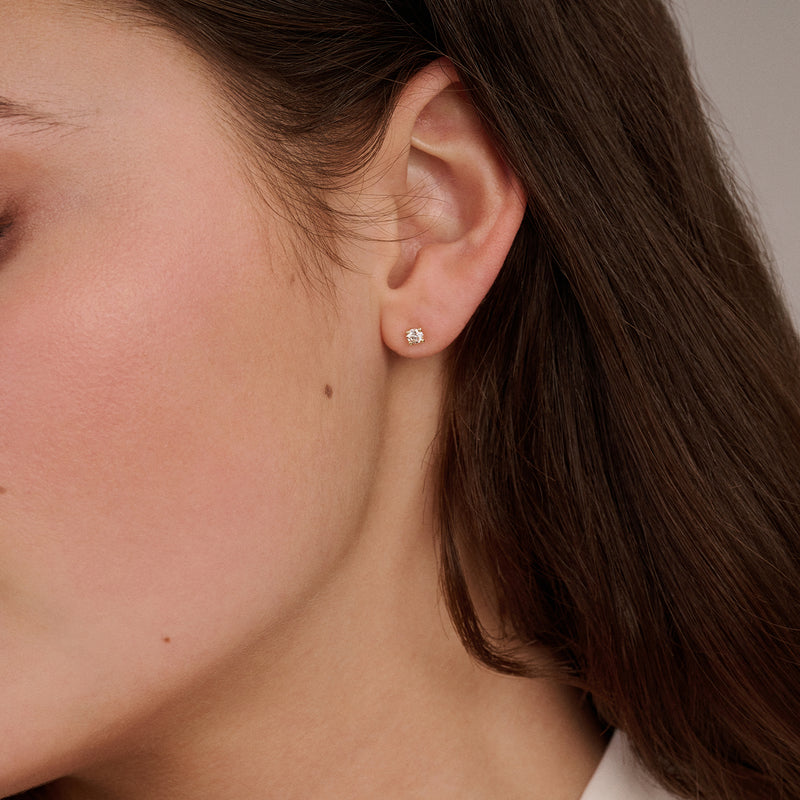 14ct yellow gold stud earring with Lab Grown Diamond, worn on the earlobe.
