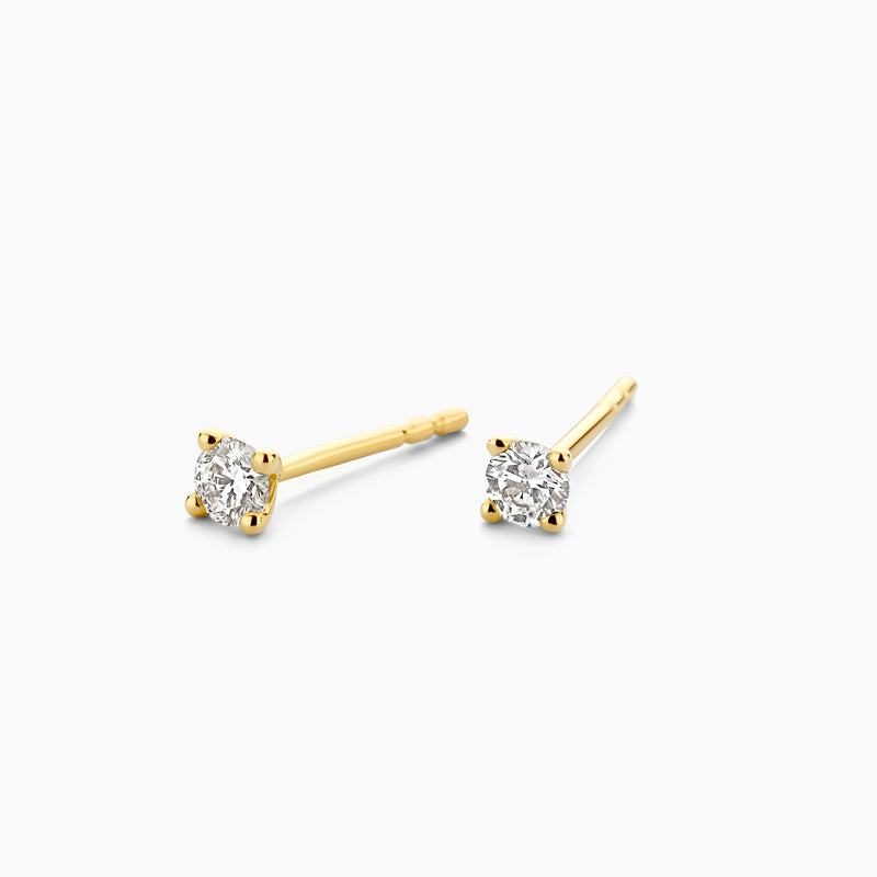 14ct yellow gold stud earrings with Lab Grown Diamond, close-up.